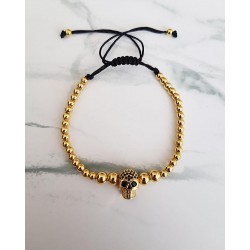 Bratara dama model deosebit cu margele aurii si skull cu pietricele negre