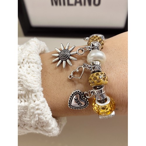 Bratara argintie cu margele si diverse accesorii deosebite galbene