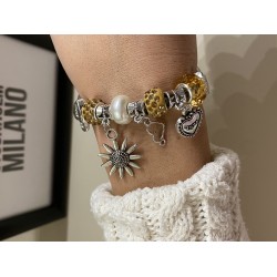 Bratara argintie cu margele si diverse accesorii deosebite galbene
